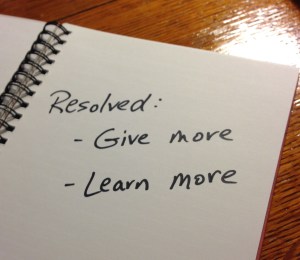 Handwritten message: "Resolved: Give more, Learn more"